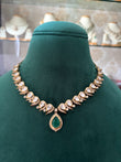 Antique finish necklace set with emerald coloured stone