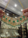 Gold plated moissanite necklace with emerald coloured stones