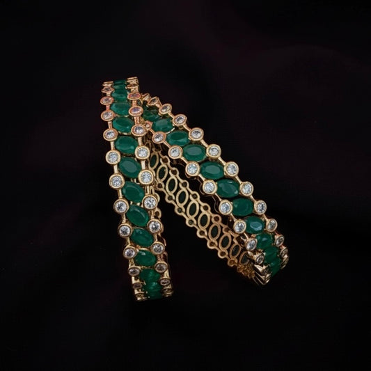 AD bangles with green stones