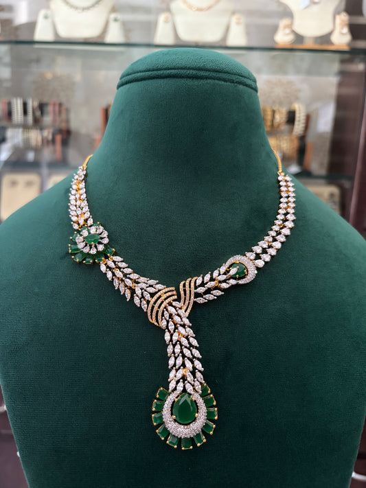 AD necklace with emerald coloured stones